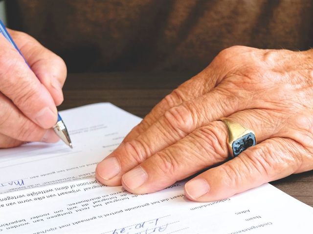 Senior signing estate planning documents